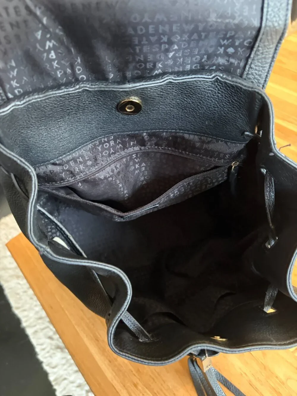 Kate Spade Pebbled Leather Backpack with tassles